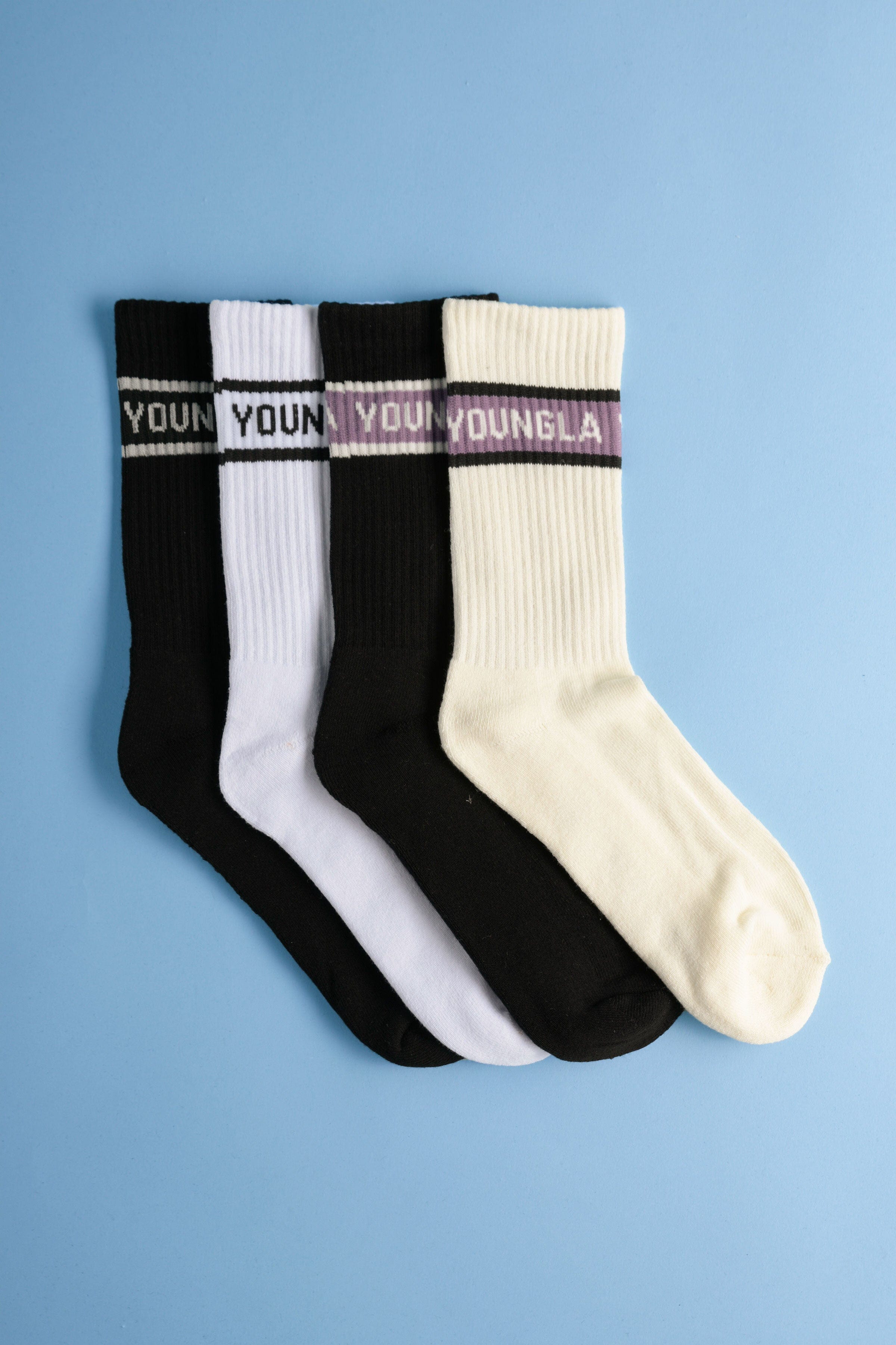 High top athletic socks with cushioning and arch support in a gym setting