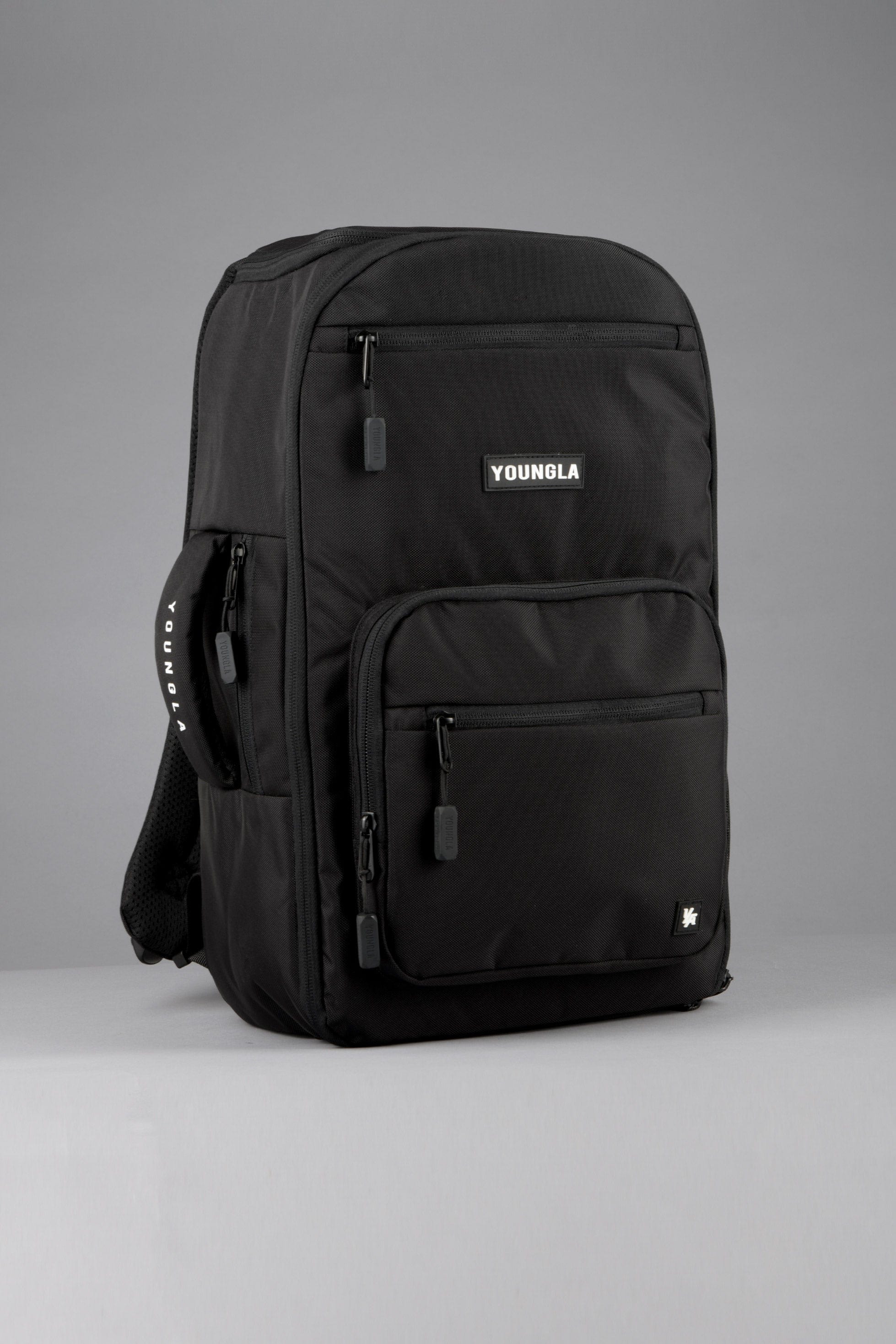 YoungLA Expedition backpack open, displaying laptop sleeve and organizer pockets