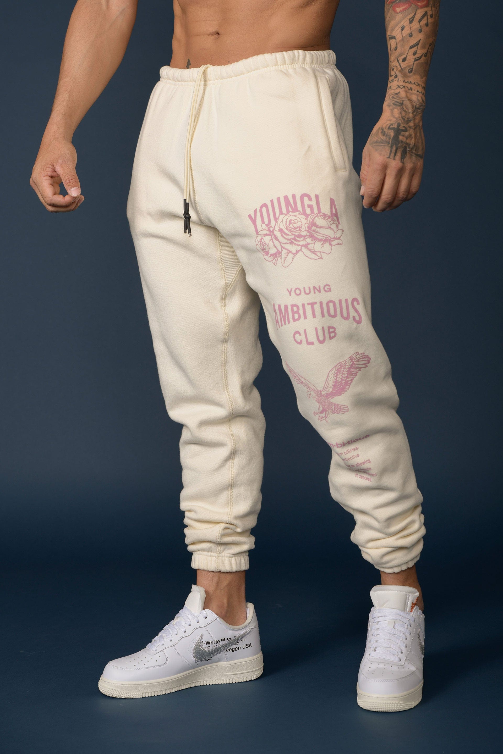 Front angle view of mens joggers showcasing oversized fit and printed leg design