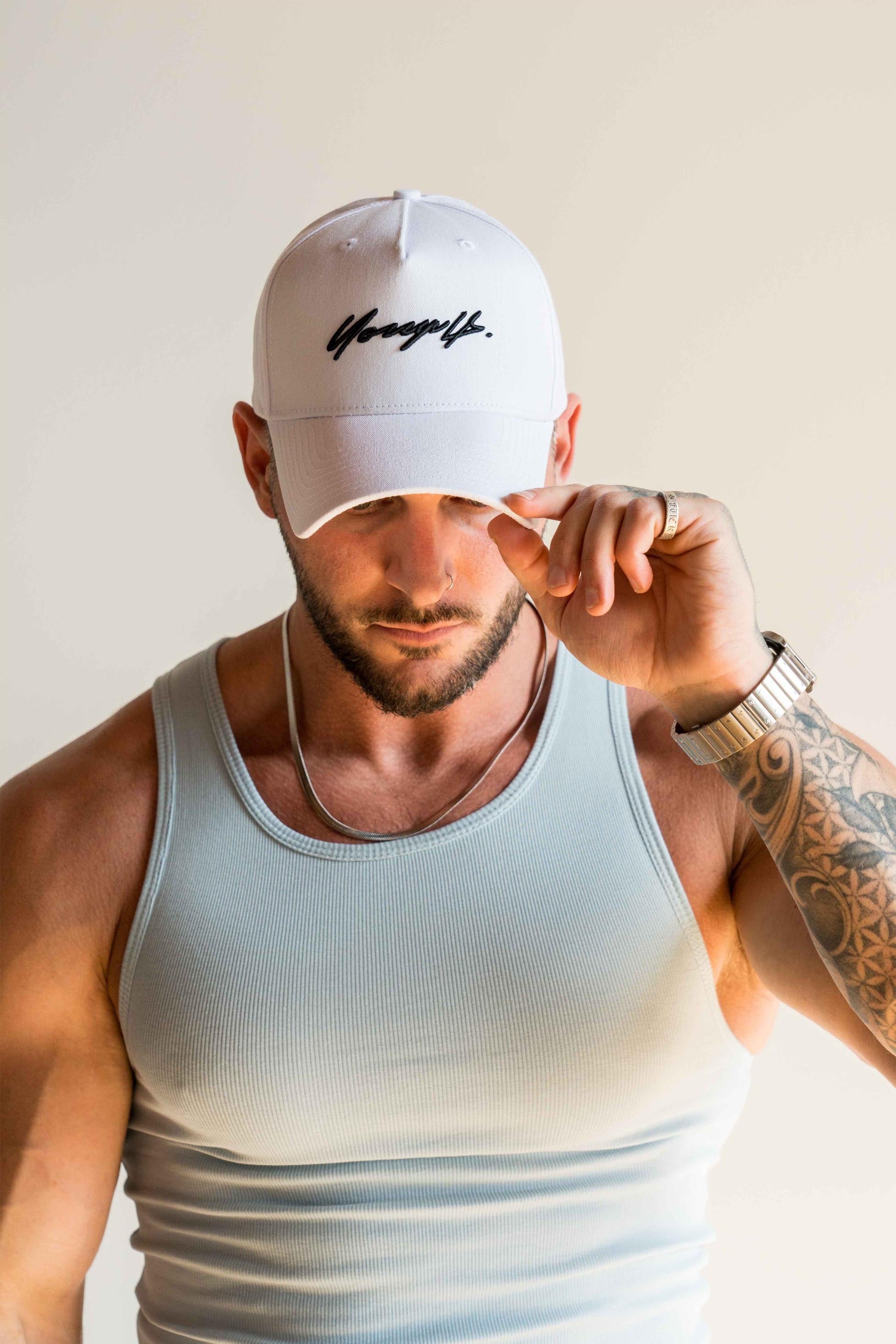 Close-up of the cotton signature snapback hat showcasing its curved brim and high crown.