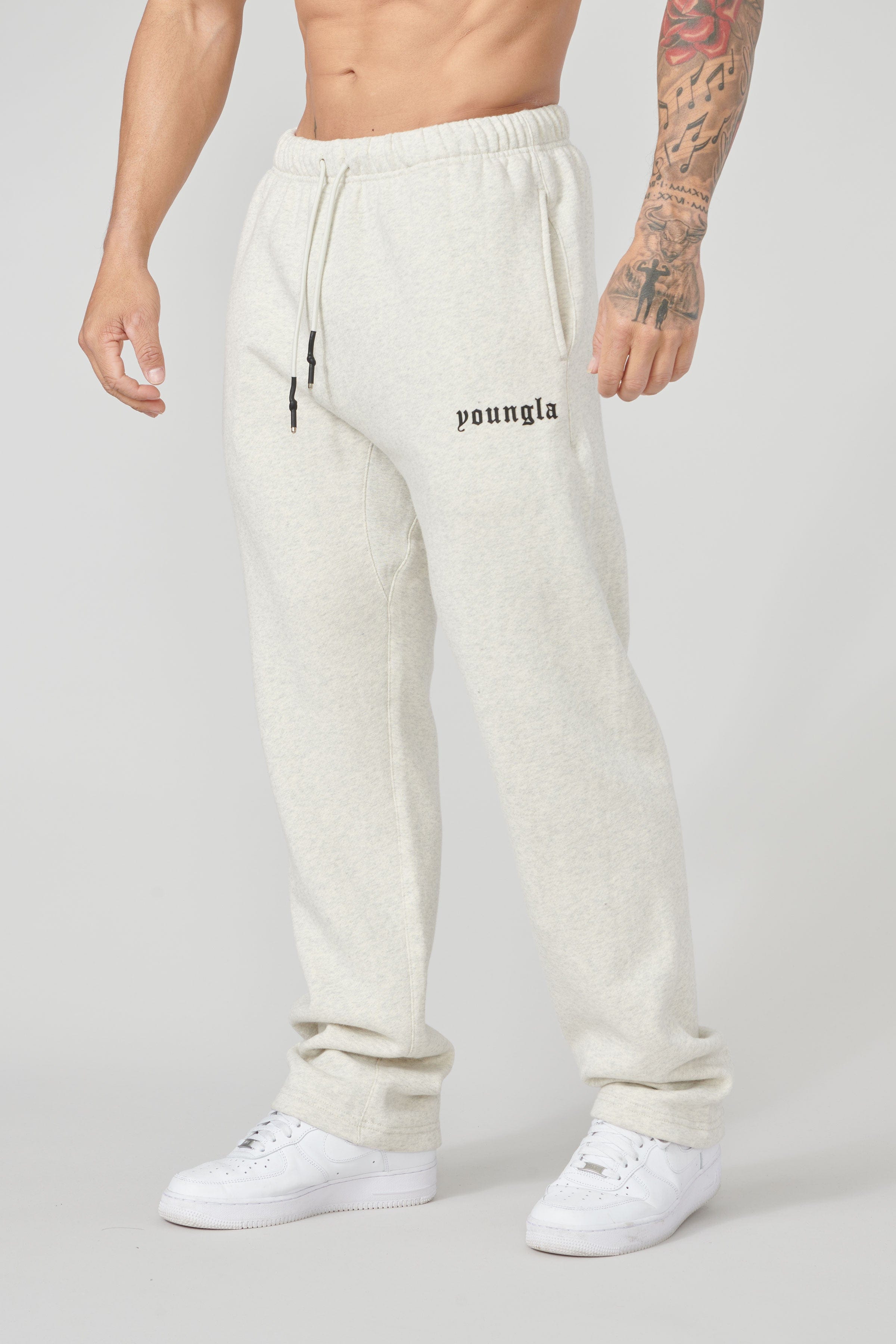 Front view of men's grey no-cuff joggers showcasing side pockets.